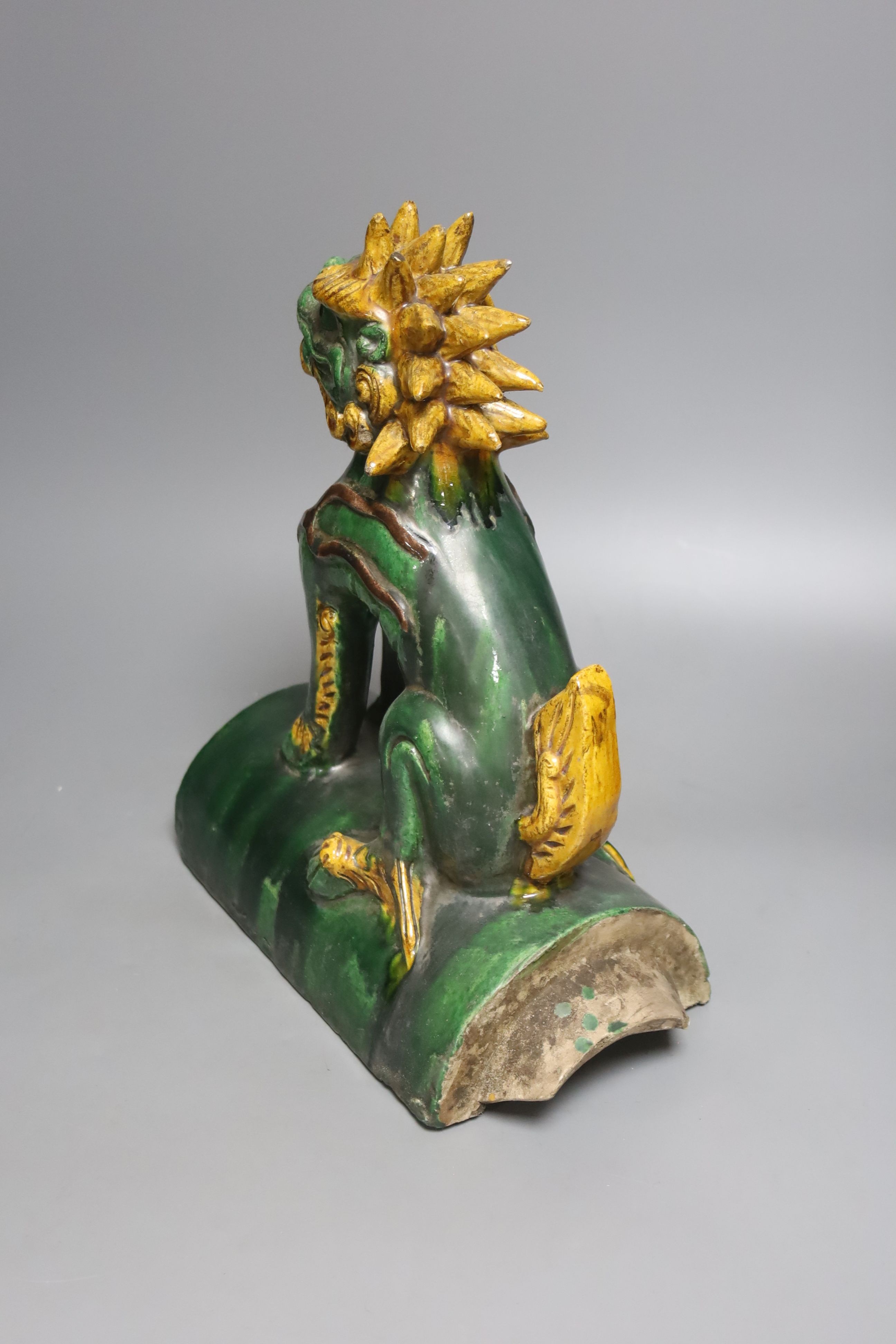 A Chinese pottery ‘lion dog’ ridge tile 33cm
